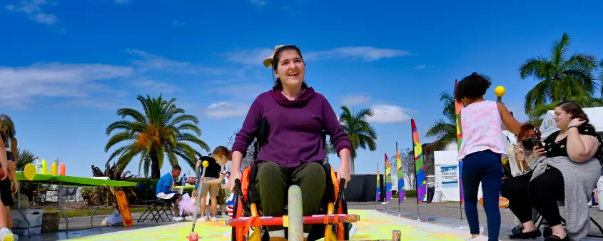 Woman in wheelchair at outdoor event